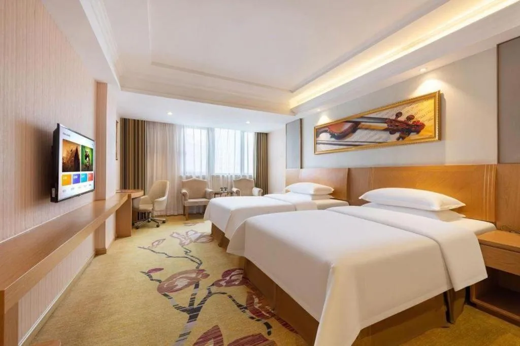 Bed in Vienna Hotel Guangzhou Baiyun Airport Huadu Avenue