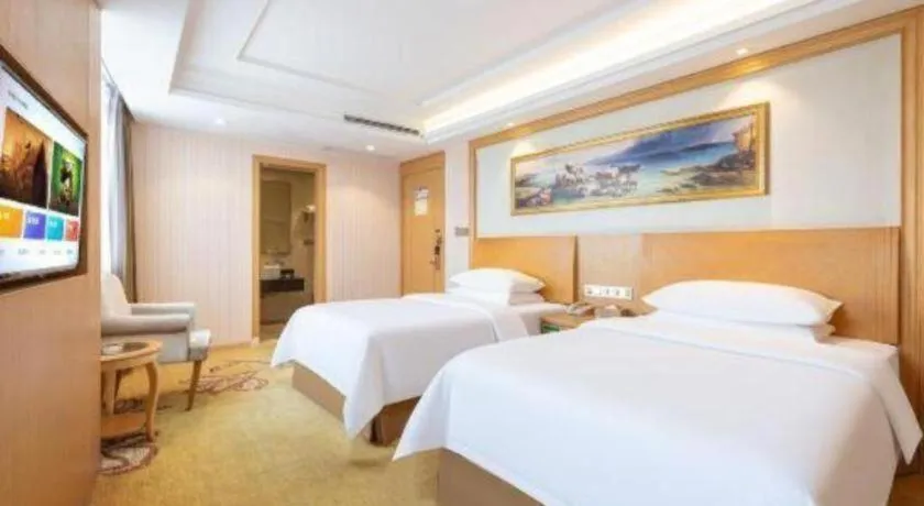 Bed in Vienna Hotel Guangzhou Baiyun Airport Huadu Avenue