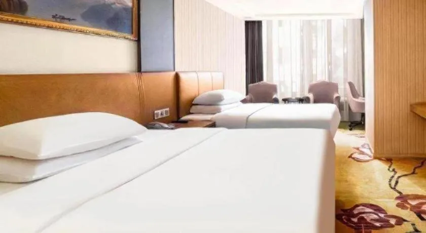 Bed in Vienna Hotel Guangzhou Baiyun Airport Huadu Avenue