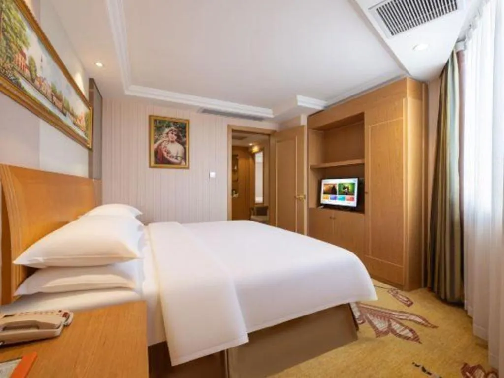 Bed in Vienna Hotel Guangzhou Baiyun Airport Huadu Avenue