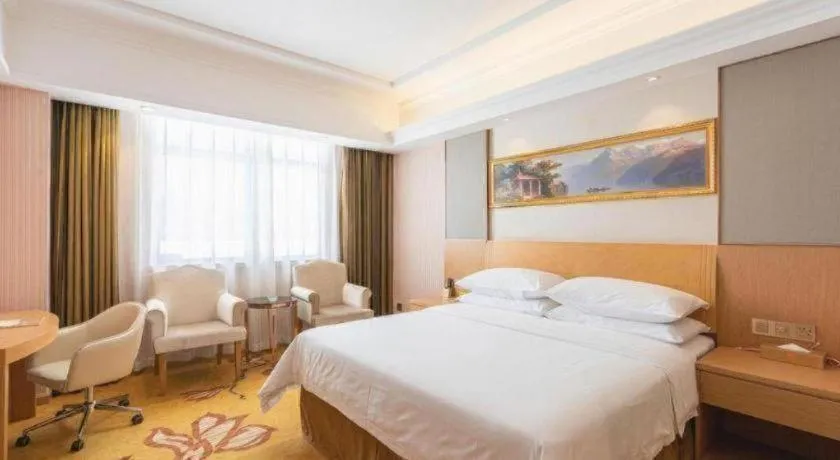 Bed in Vienna Hotel Guangzhou Baiyun Airport Huadu Avenue