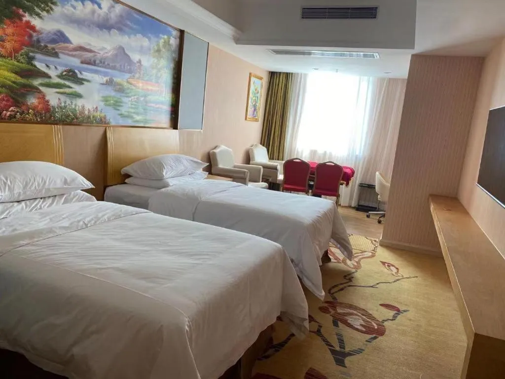 Bed in Vienna Hotel Guangzhou Baiyun Airport Huadu Avenue