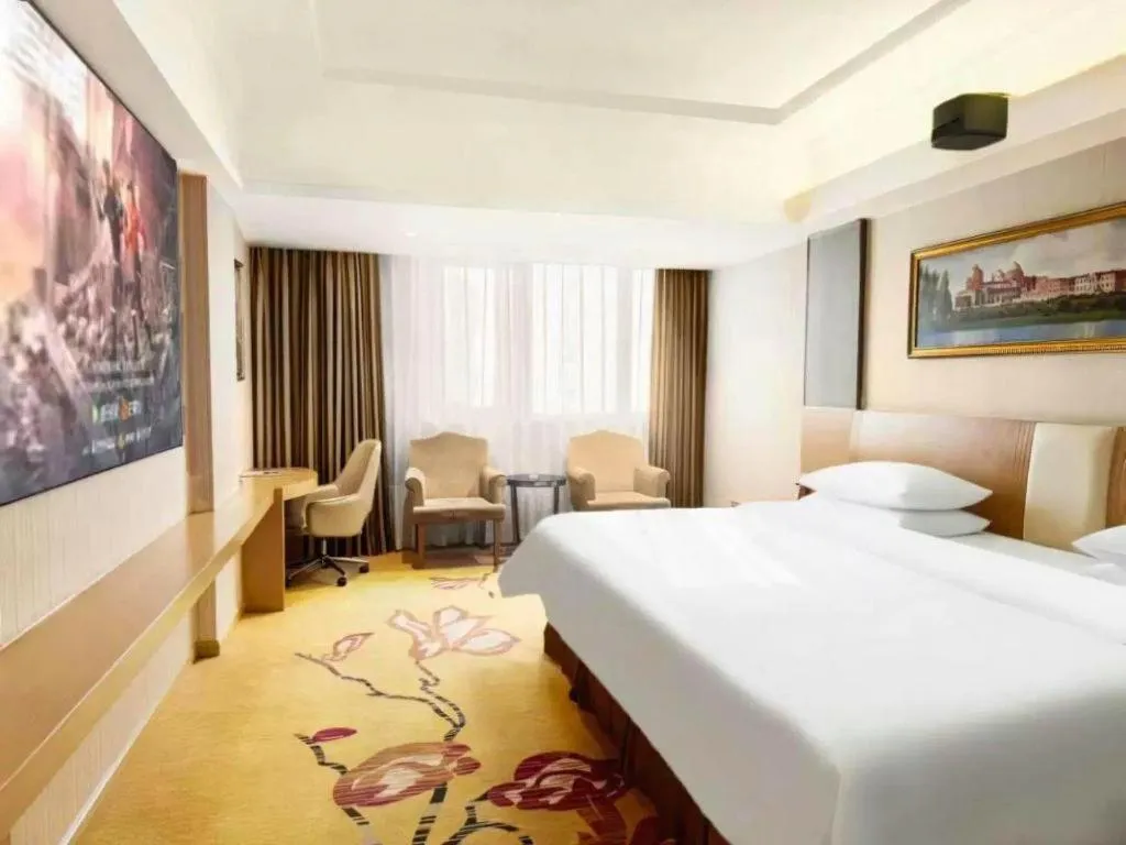 Bed in Vienna Hotel Guangzhou Baiyun Airport Huadu Avenue
