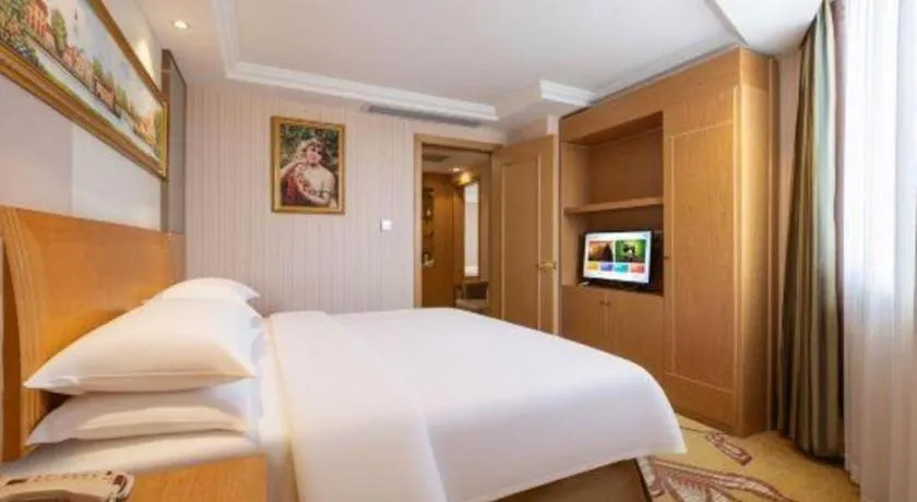 Bed in Vienna Hotel Guangzhou Baiyun Airport Huadu Avenue