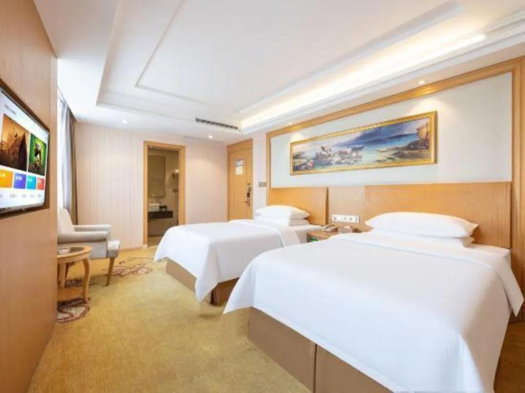 Bed in Vienna Hotel Guangzhou Baiyun Airport Huadu Avenue