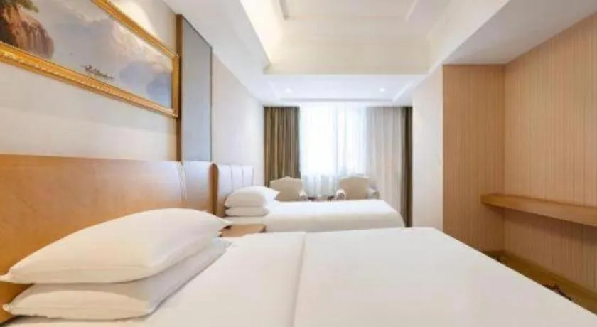 Bed in Vienna Hotel Guangzhou Baiyun Airport Huadu Avenue