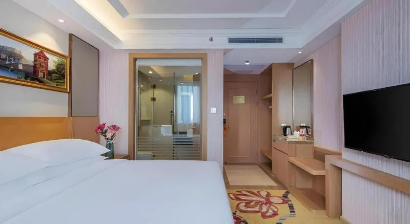 Bed in Vienna Hotel Guangzhou Baiyun Airport Huadu Avenue