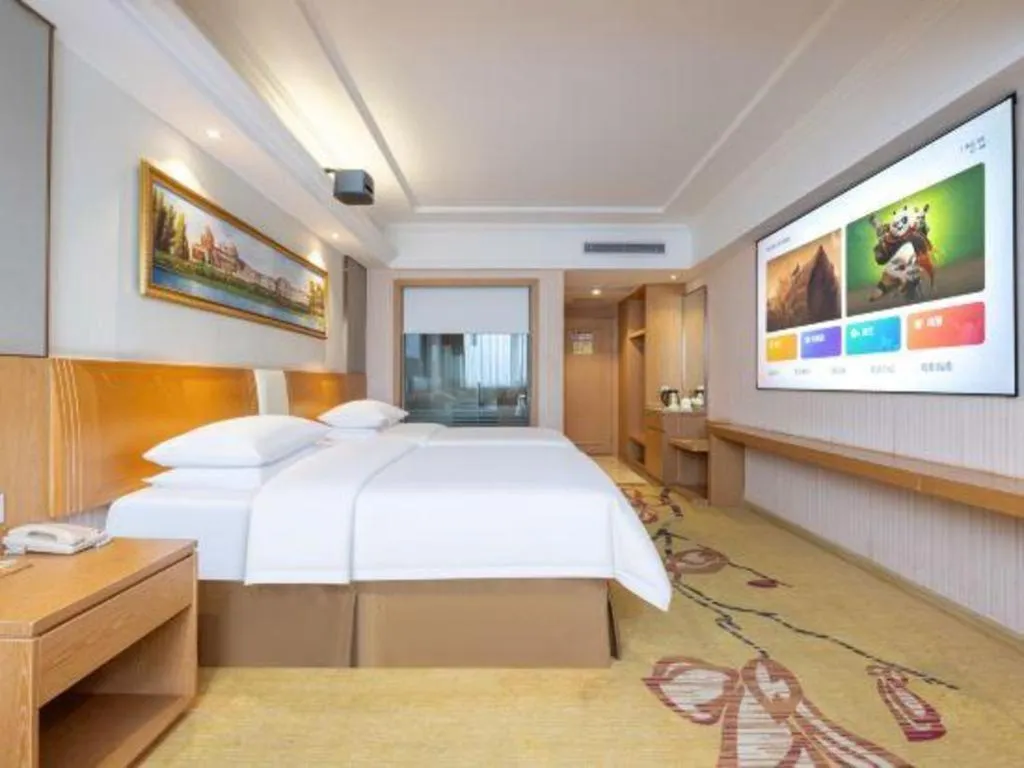 Bed in Vienna Hotel Guangzhou Baiyun Airport Huadu Avenue