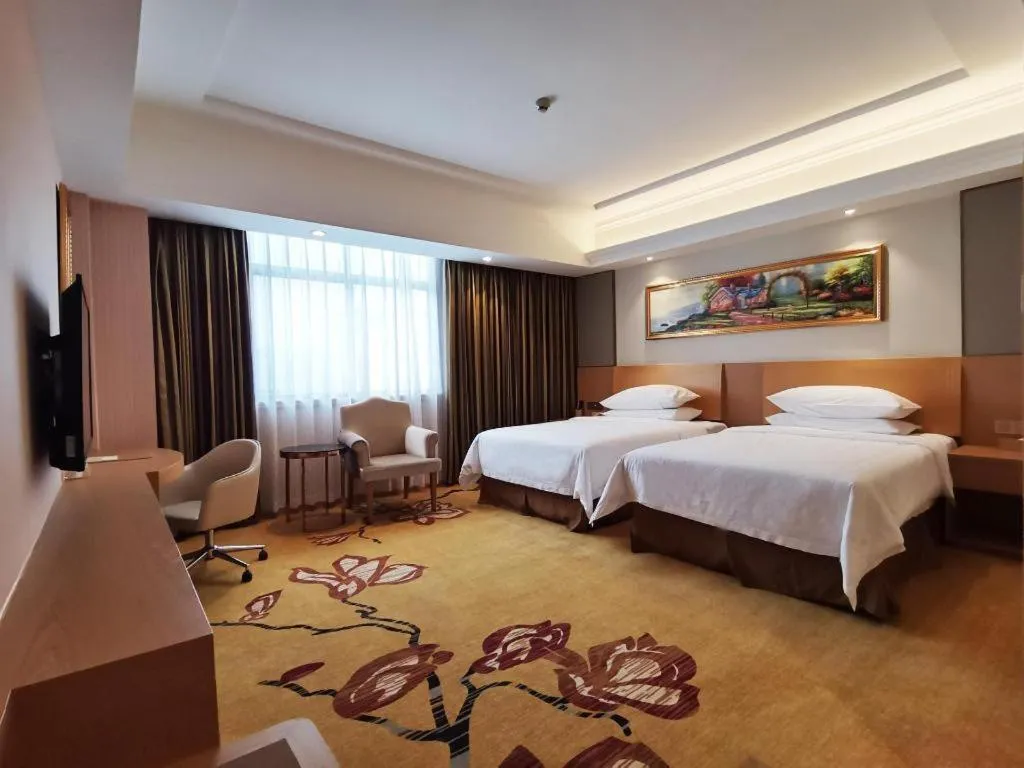 Bed in Vienna Hotel Guangzhou Baiyun Airport Huadu Avenue
