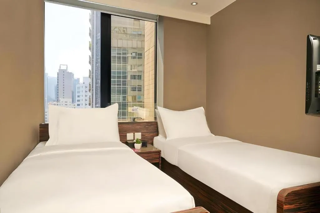 Bed in J Link Hotel