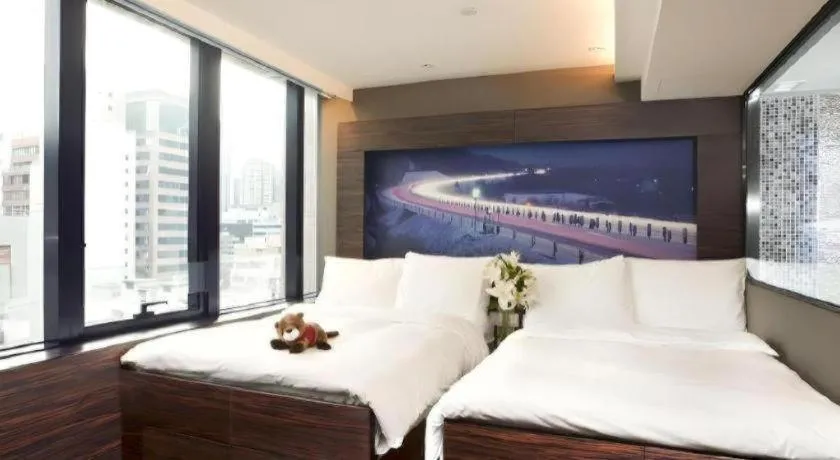 Bed in J Link Hotel
