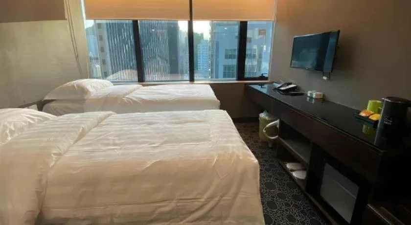 Bed in J Link Hotel