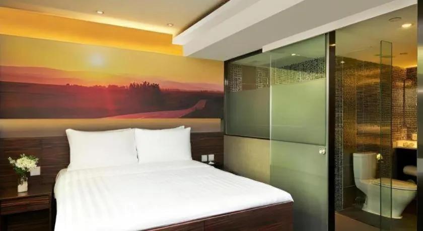 Bed in J Link Hotel