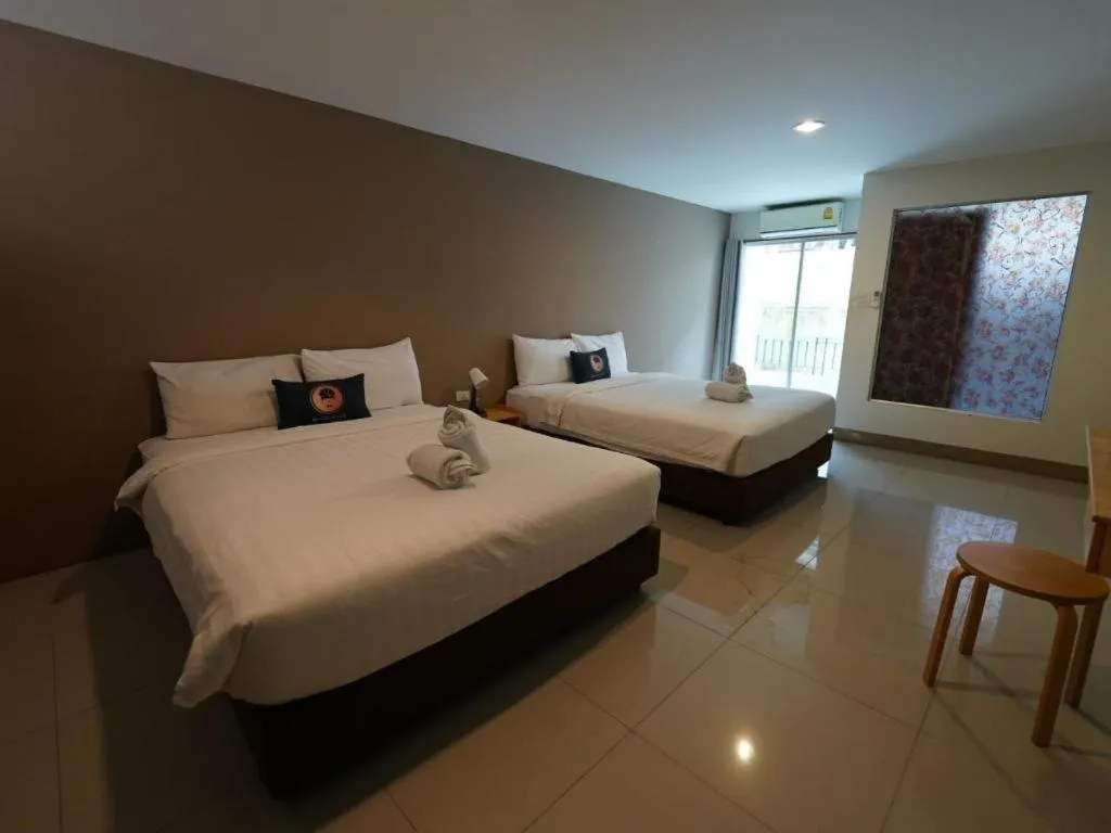 Bed in RoomQuest Chiang Mai Tha Sala