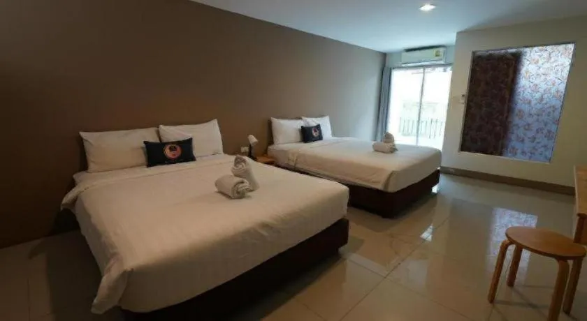 Bed in RoomQuest Chiang Mai Tha Sala