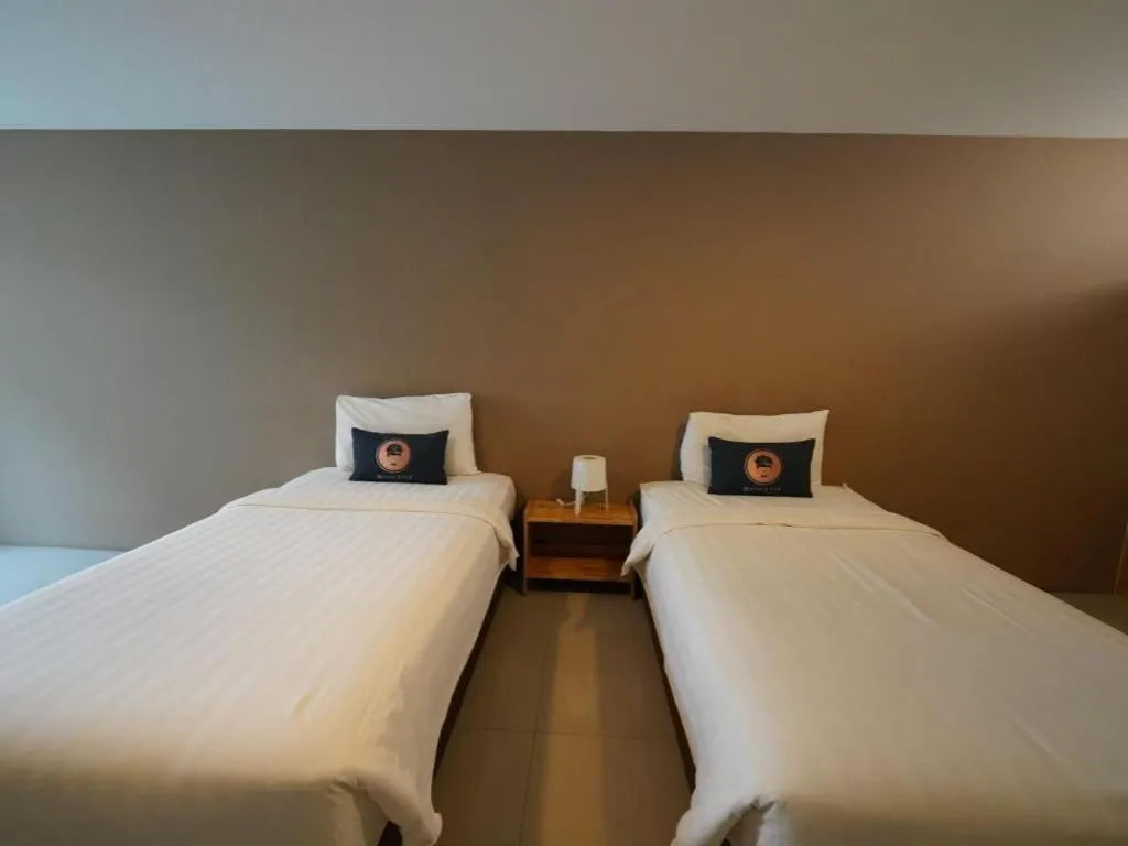 Bed in RoomQuest Chiang Mai Tha Sala