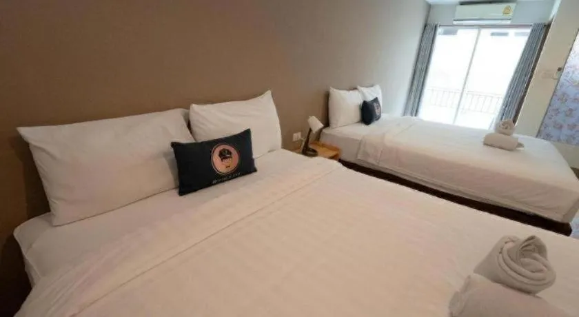 Bed in RoomQuest Chiang Mai Tha Sala