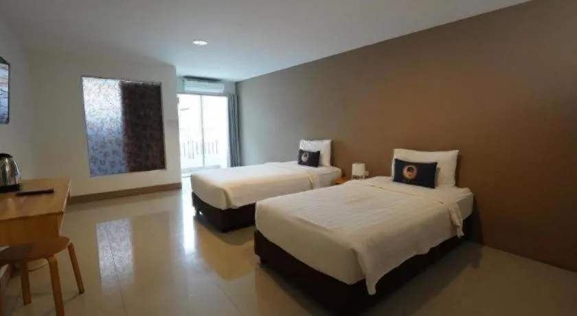 Bed in RoomQuest Chiang Mai Tha Sala