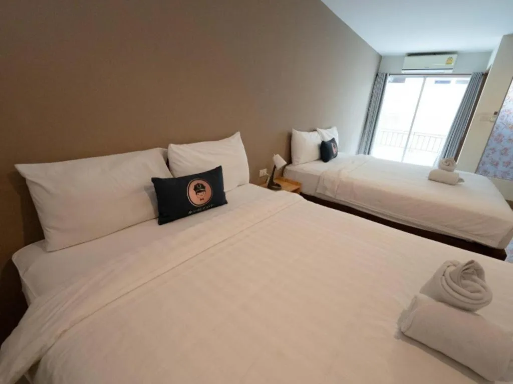 Bed in RoomQuest Chiang Mai Tha Sala