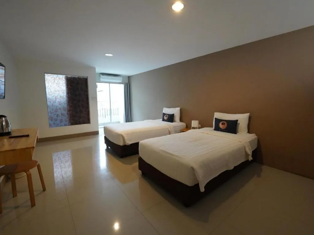 Bed in RoomQuest Chiang Mai Tha Sala