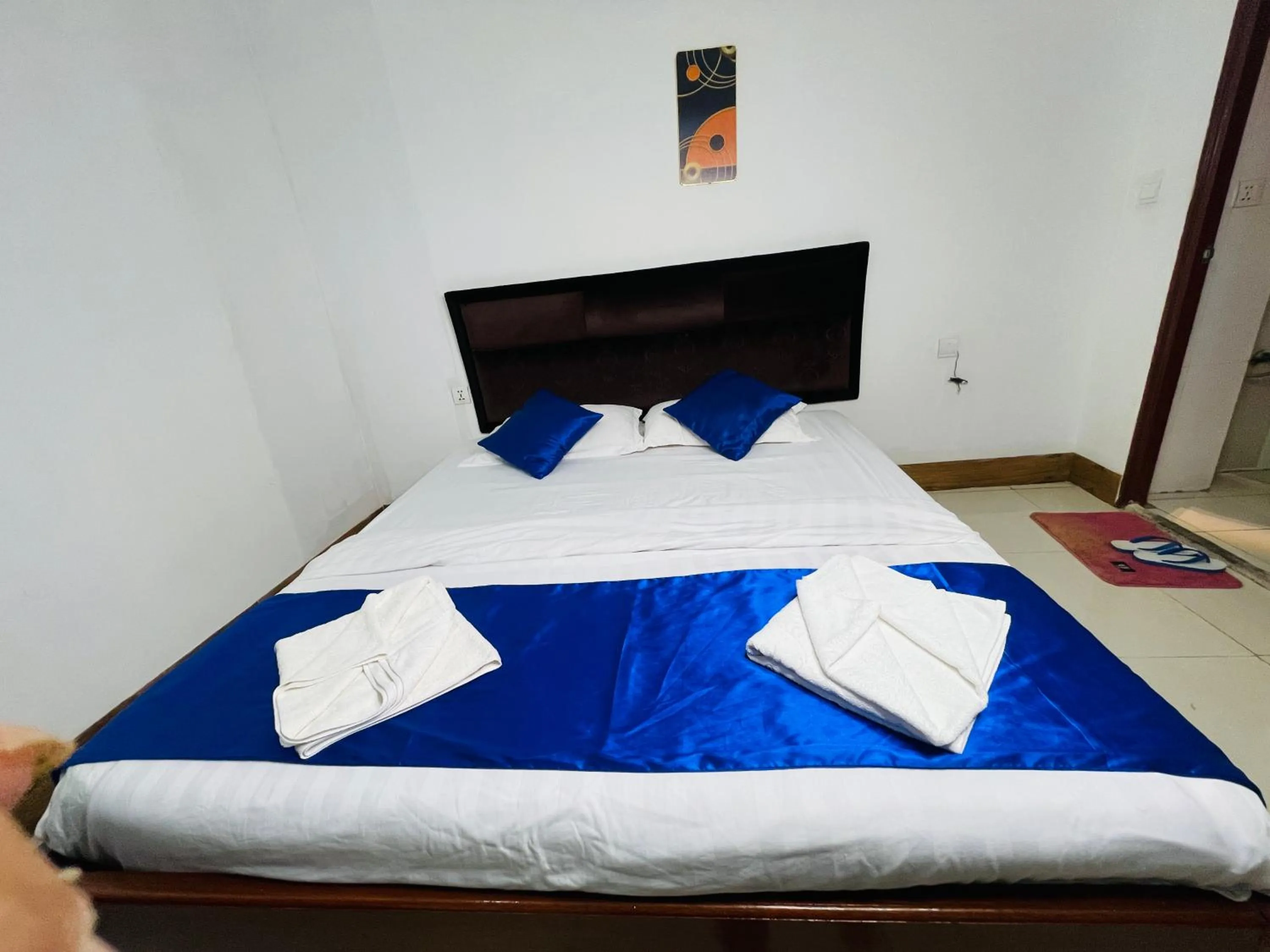 Bed in New Season Riverside Hotel