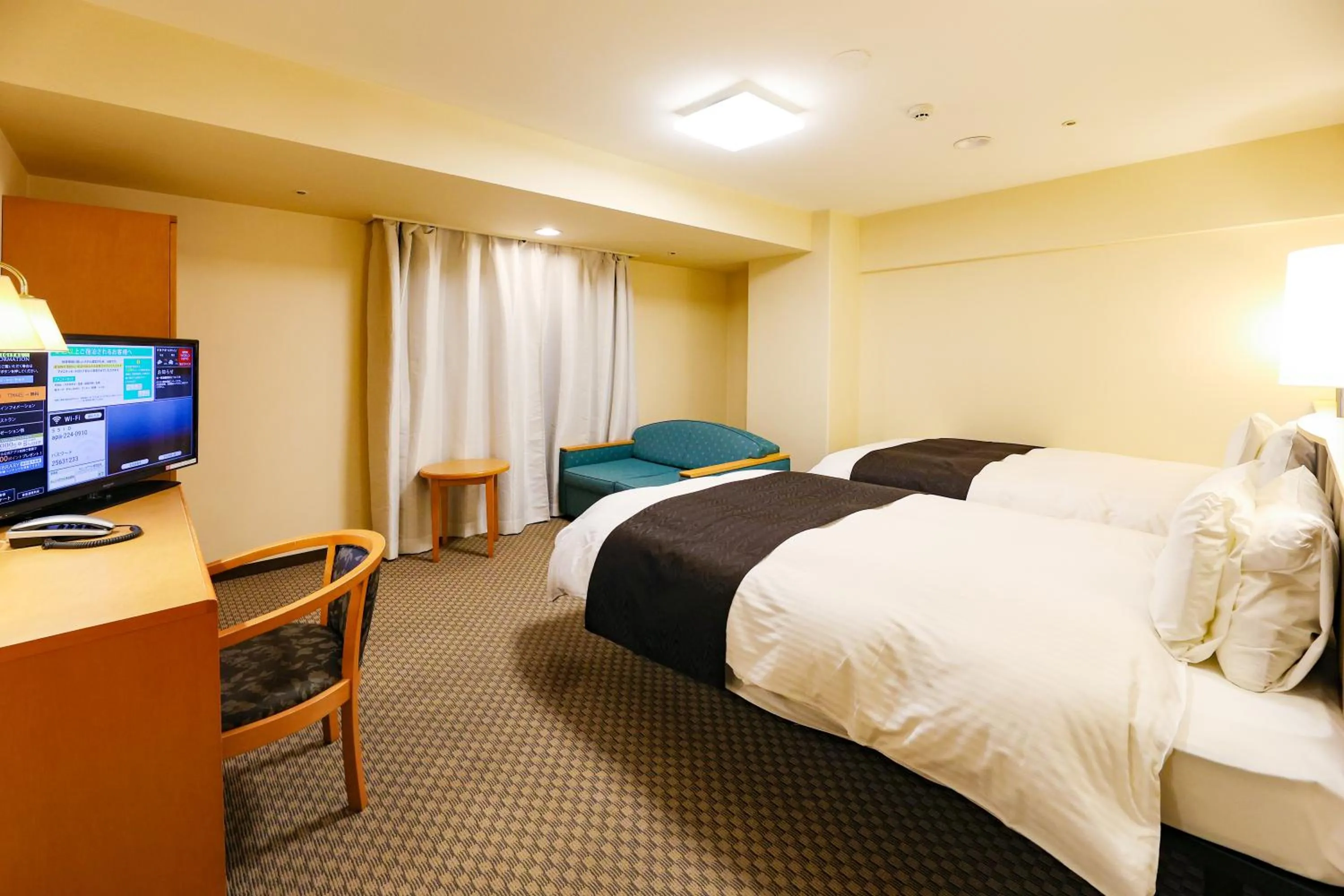 Photo of the whole room, Bed in APA Hotel Obihiro Ekimae