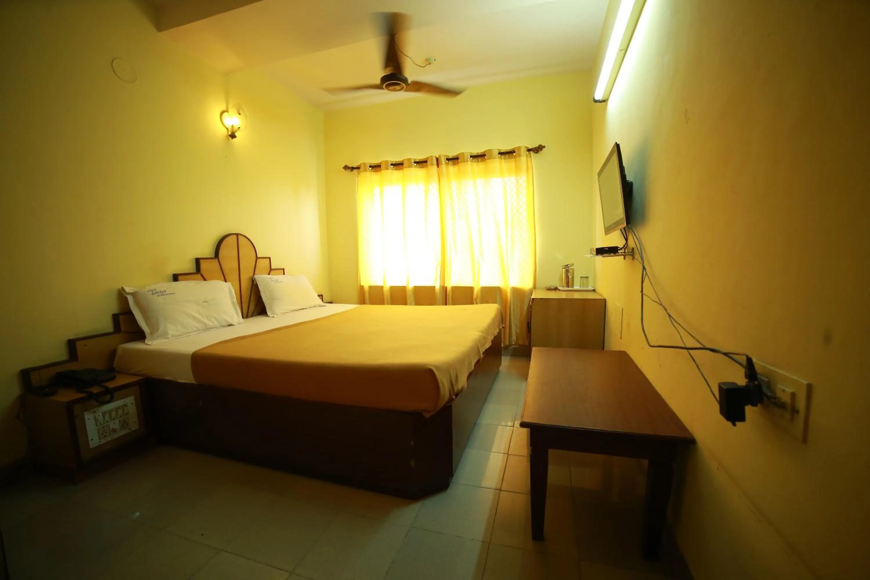 Bedroom in Luciya International Mysore