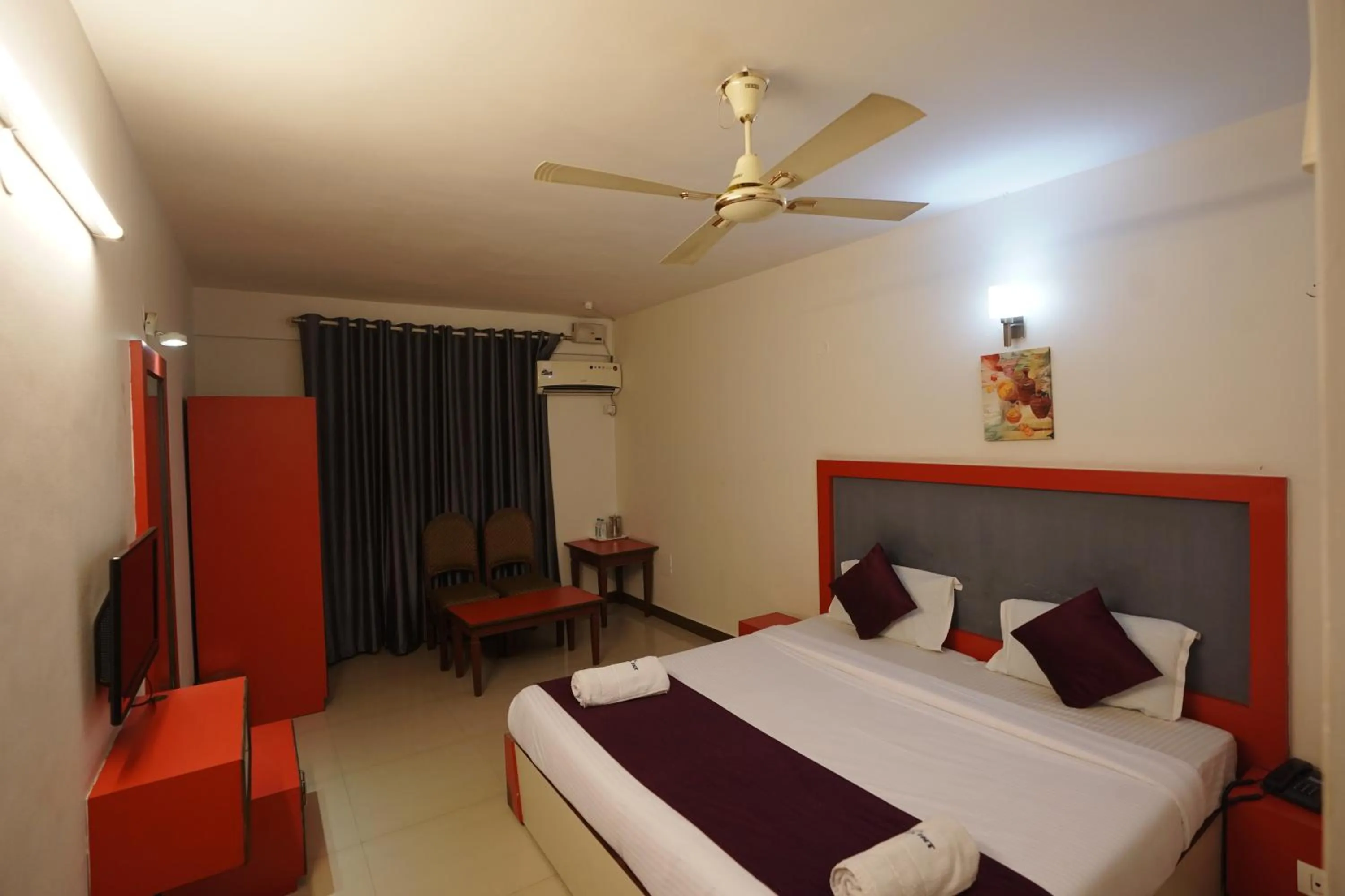 Bedroom in Luciya International Mysore