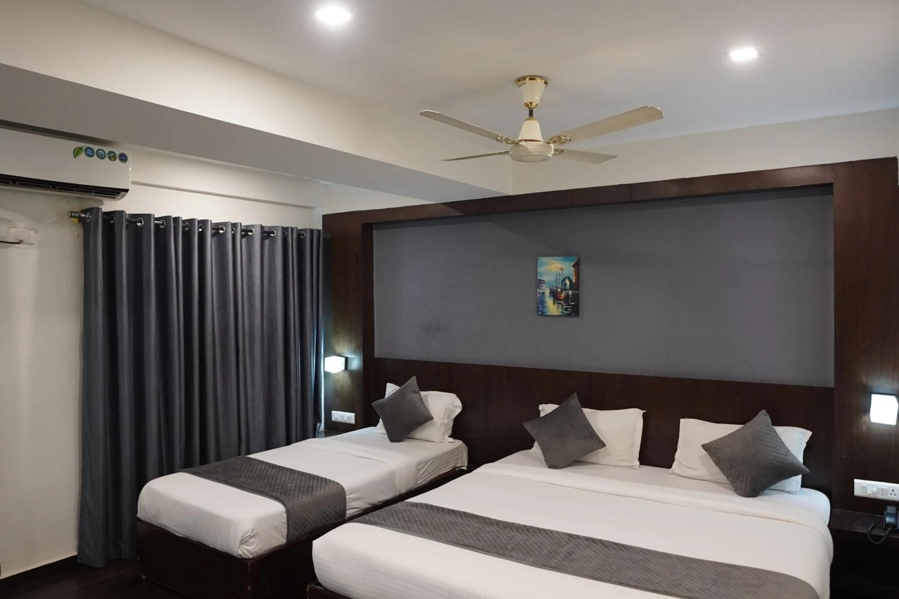 Bed in Luciya International Mysore