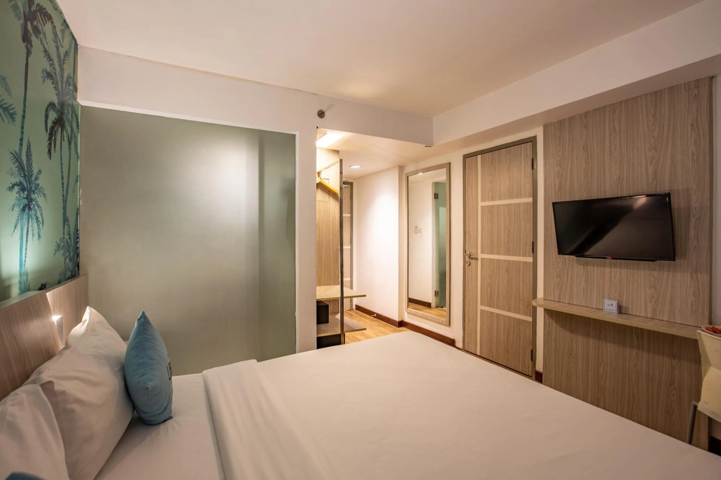 TV and multimedia, Bed in Liberta Seminyak Hotel