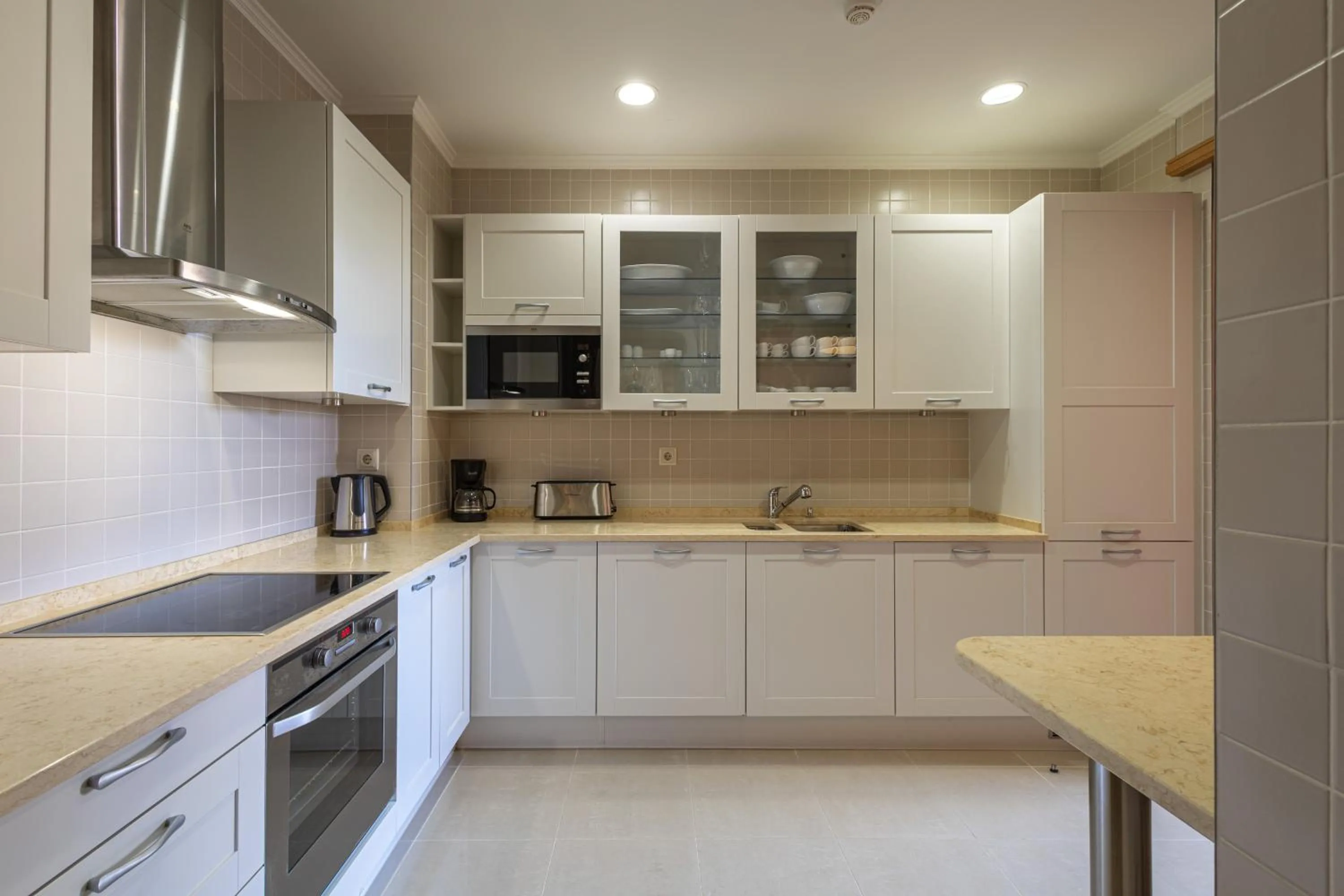 kitchen in The Residences at Victoria by Tivoli