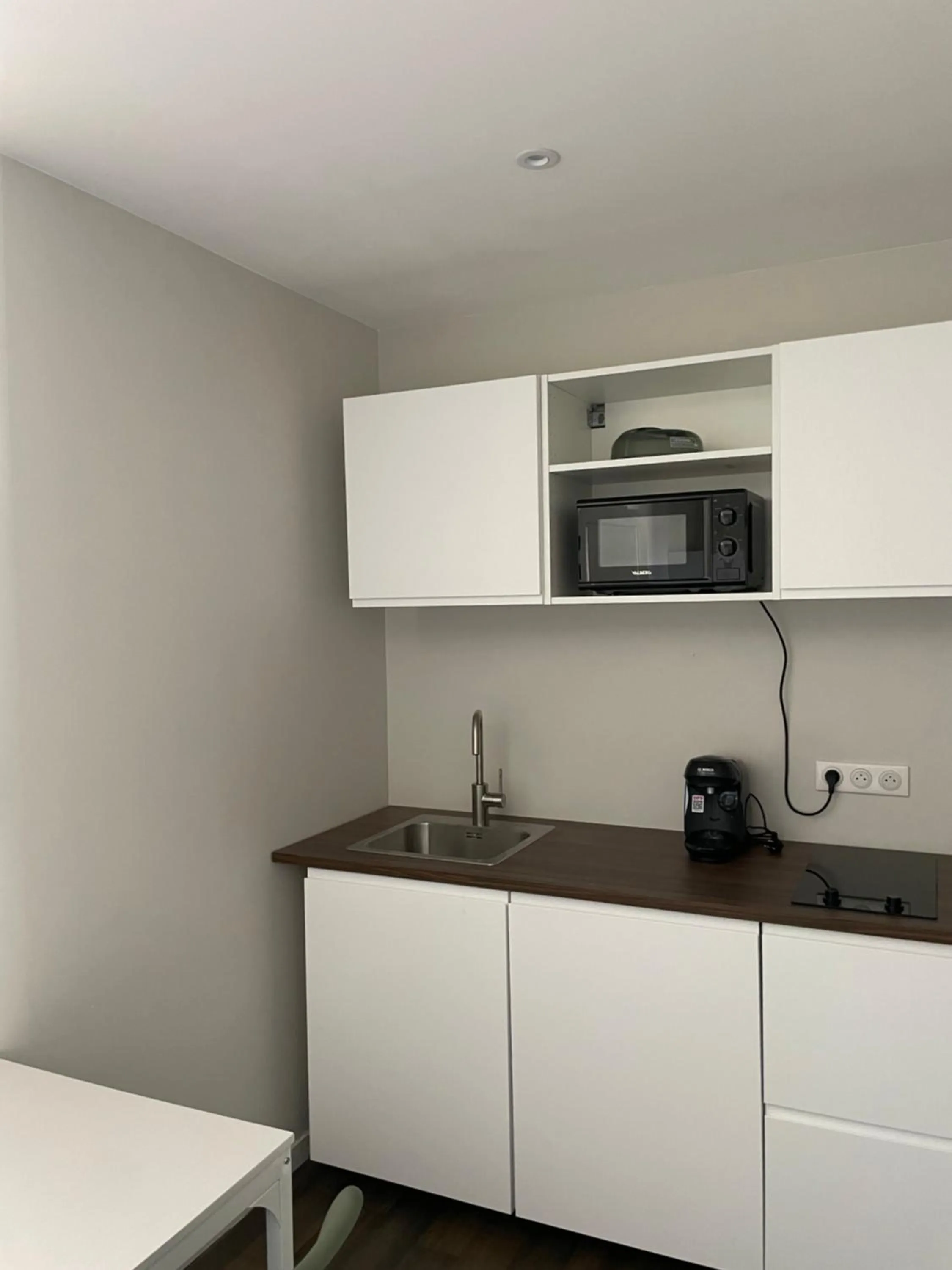 Kitchen or kitchenette in Ducey Appart'Hôtel - Les Rivières