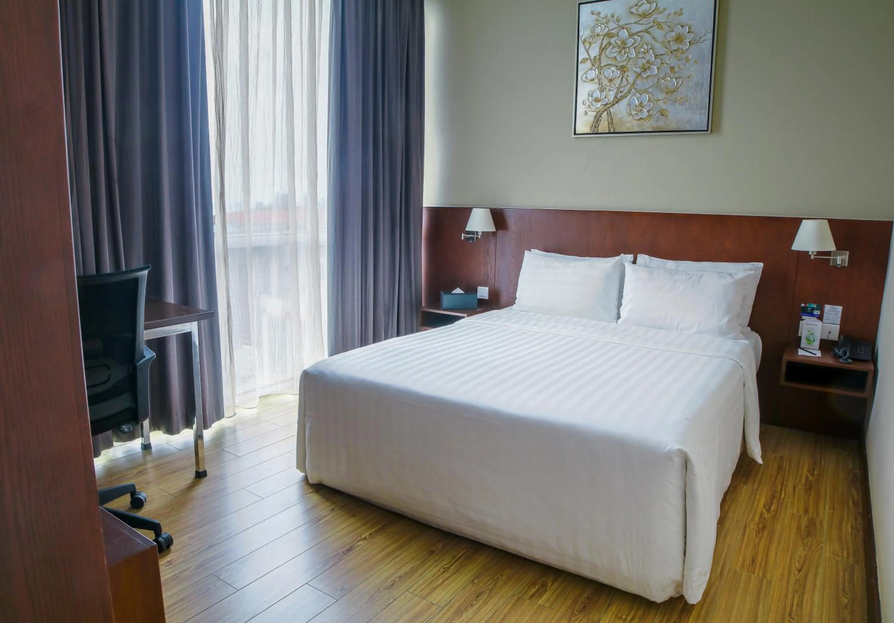 Bed in Swiss Hotel Apartment