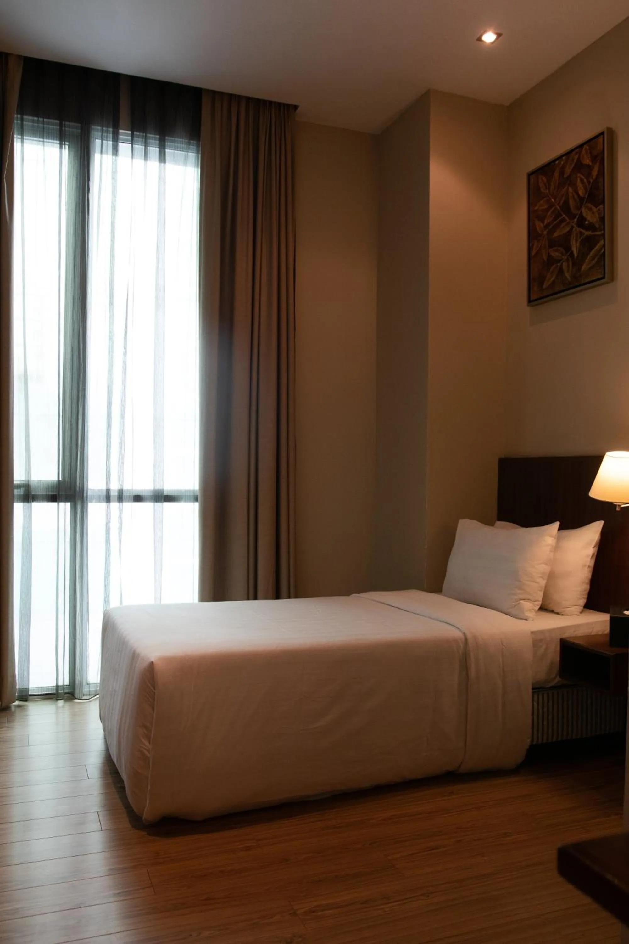 Bed in Swiss Hotel Apartment