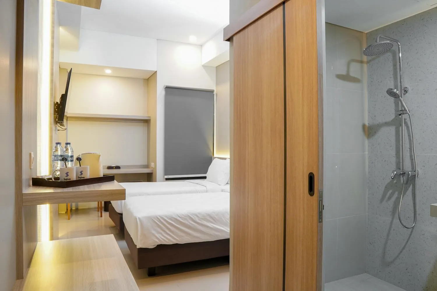 Bed in Sajiwa Inn and Suite Hotel