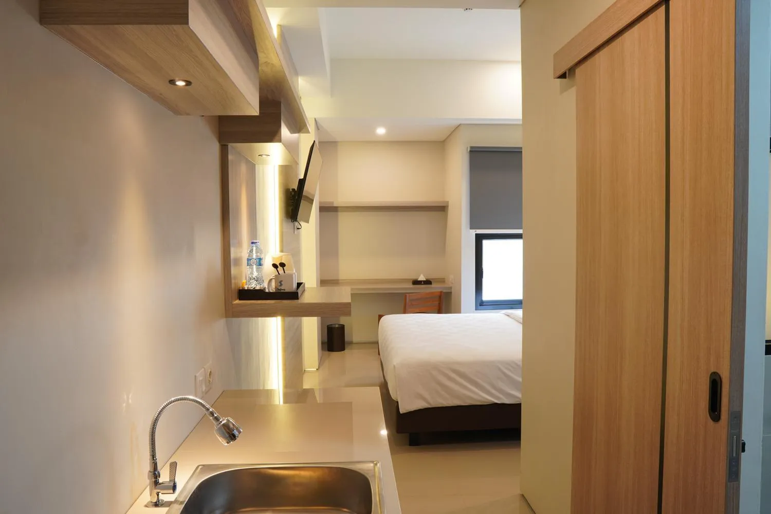 Bed in Sajiwa Inn and Suite Hotel