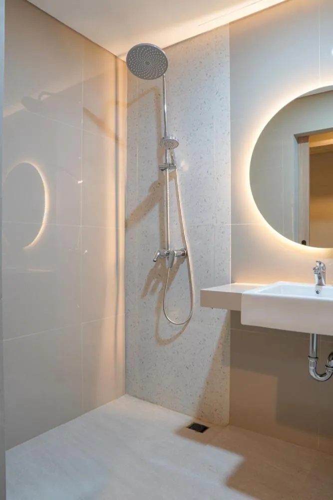 Bed in Sajiwa Inn and Suite Hotel