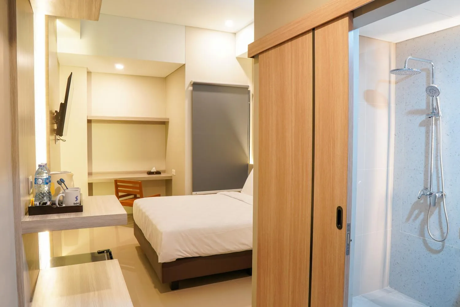 Bed in Sajiwa Inn and Suite Hotel