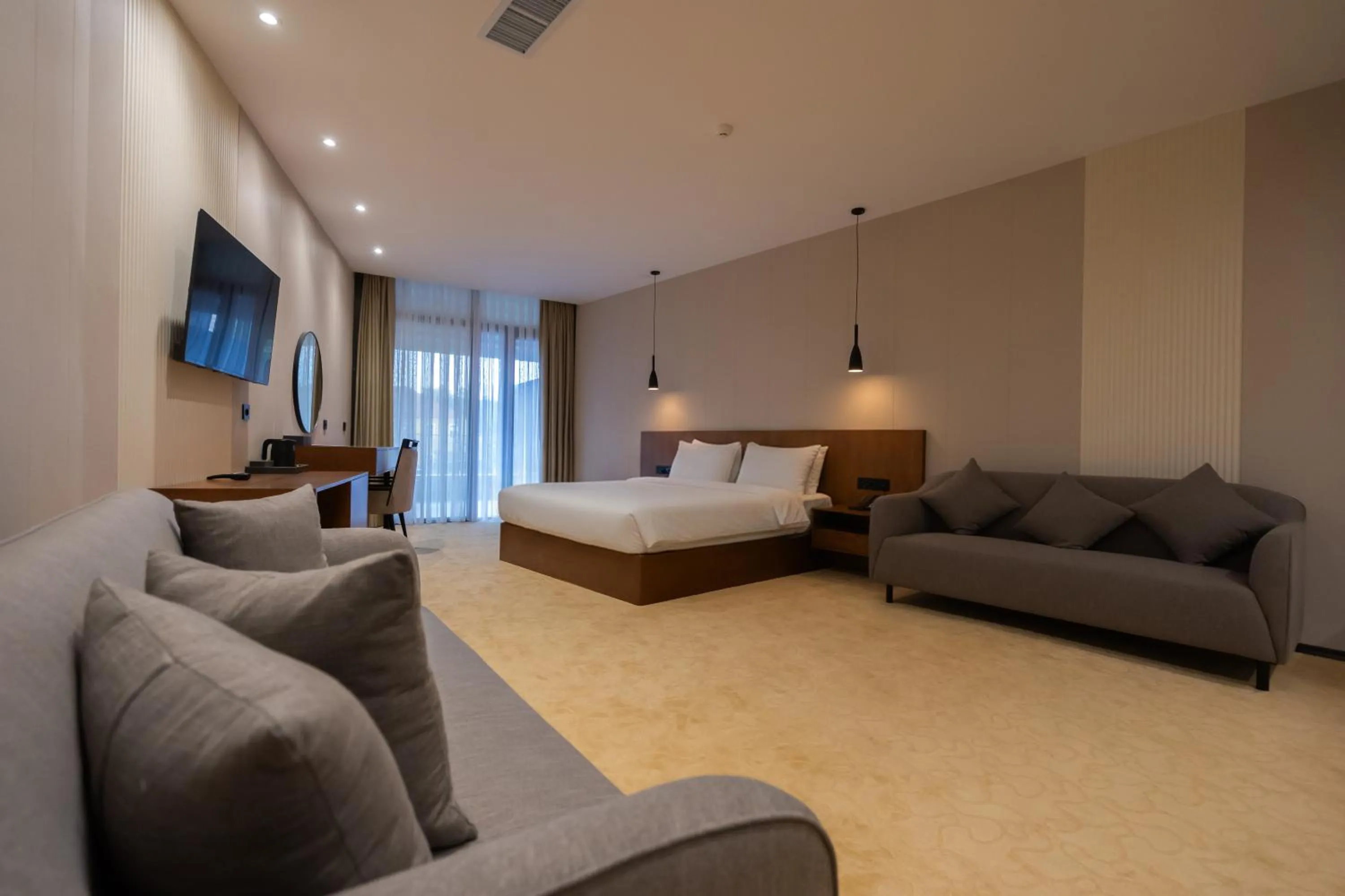 Seating area, Bed in Bushi Resort & SPA