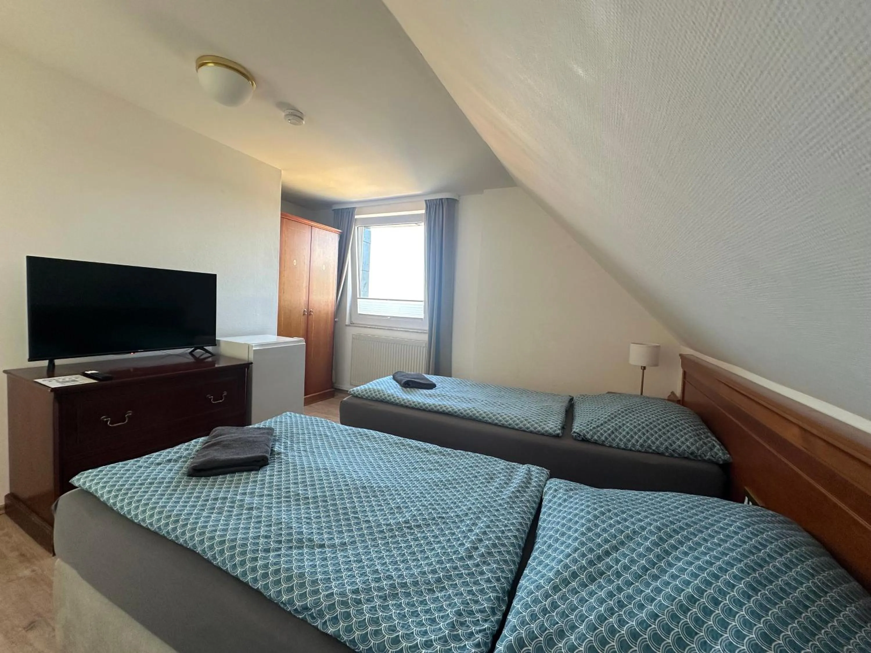 Bed in Gästehaus am Harz - Monteurzimmer mit Hotelstandard