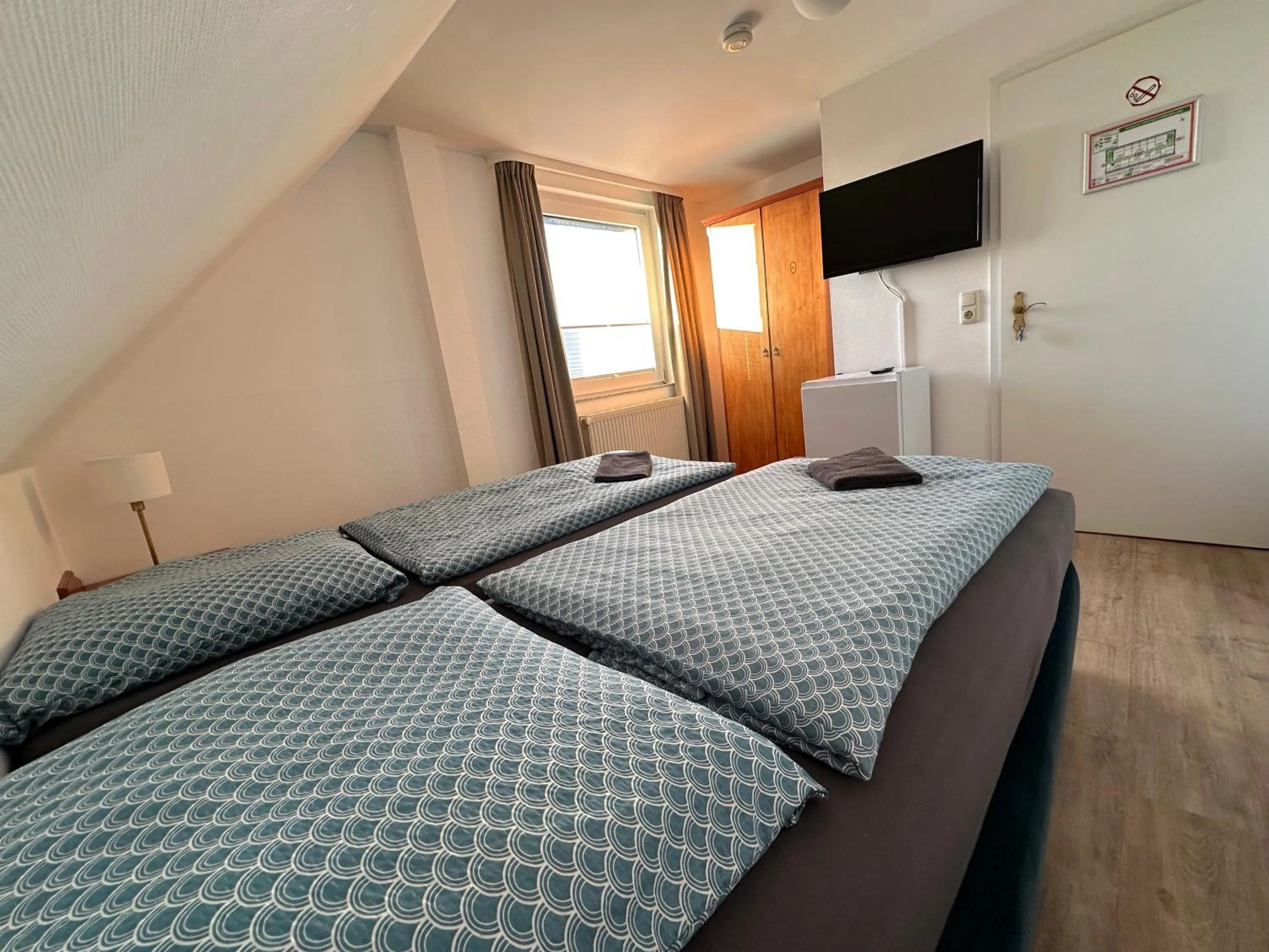 Bed in Gästehaus am Harz - Monteurzimmer mit Hotelstandard