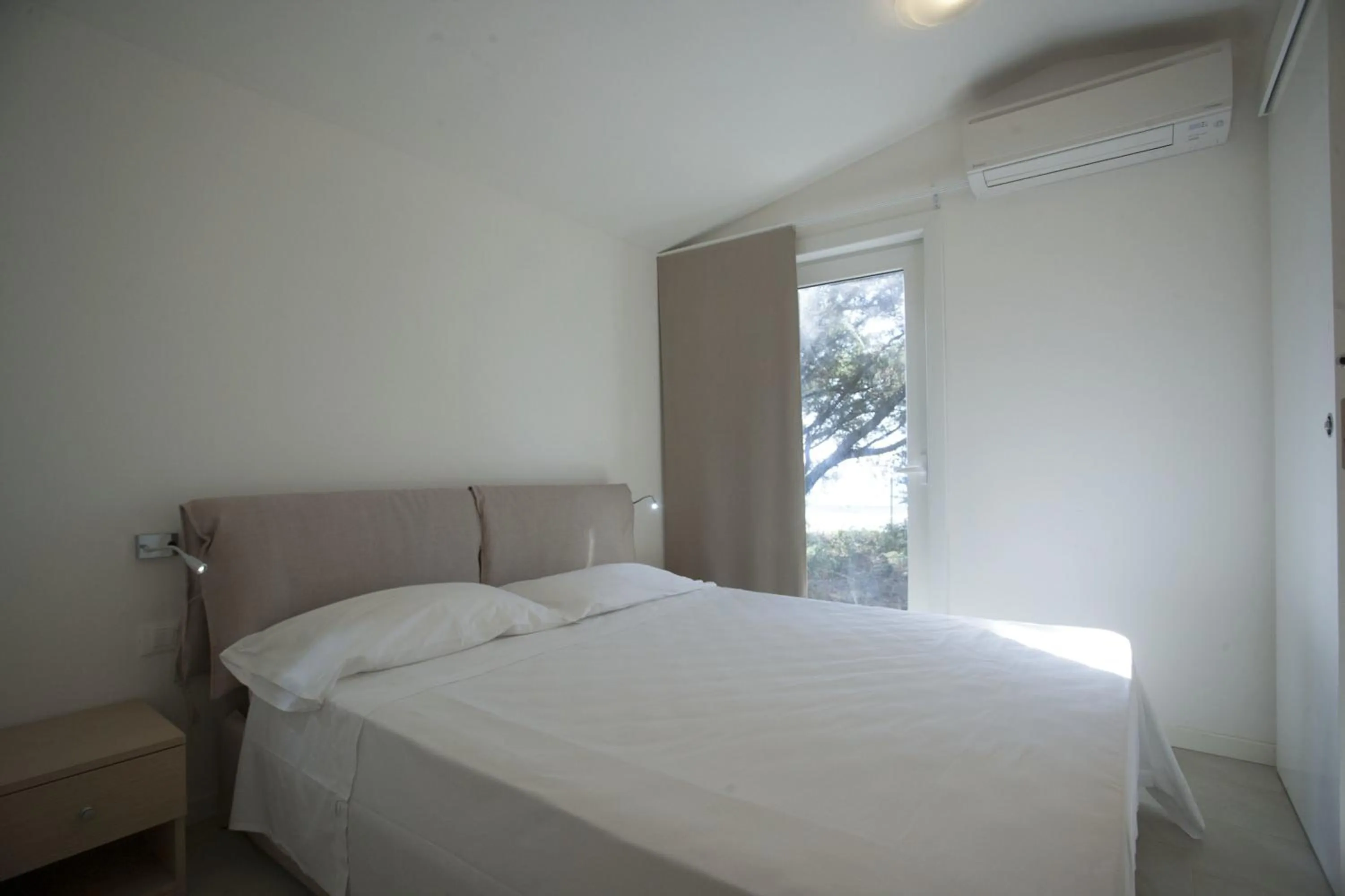 Bed in PuntAla Camp & Resort