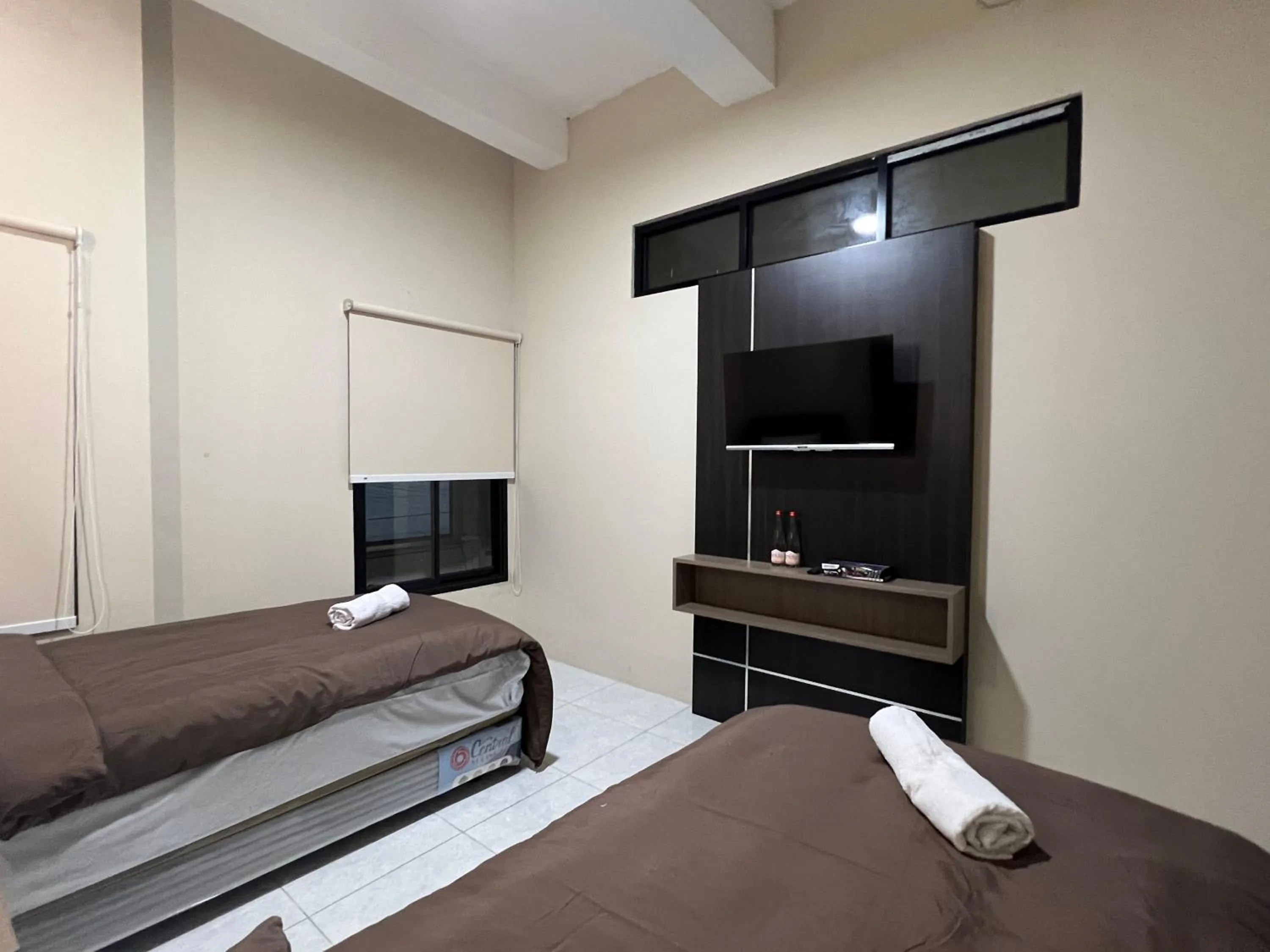 Bed in Brenn Hotel Semarang Mitra Reddoorz