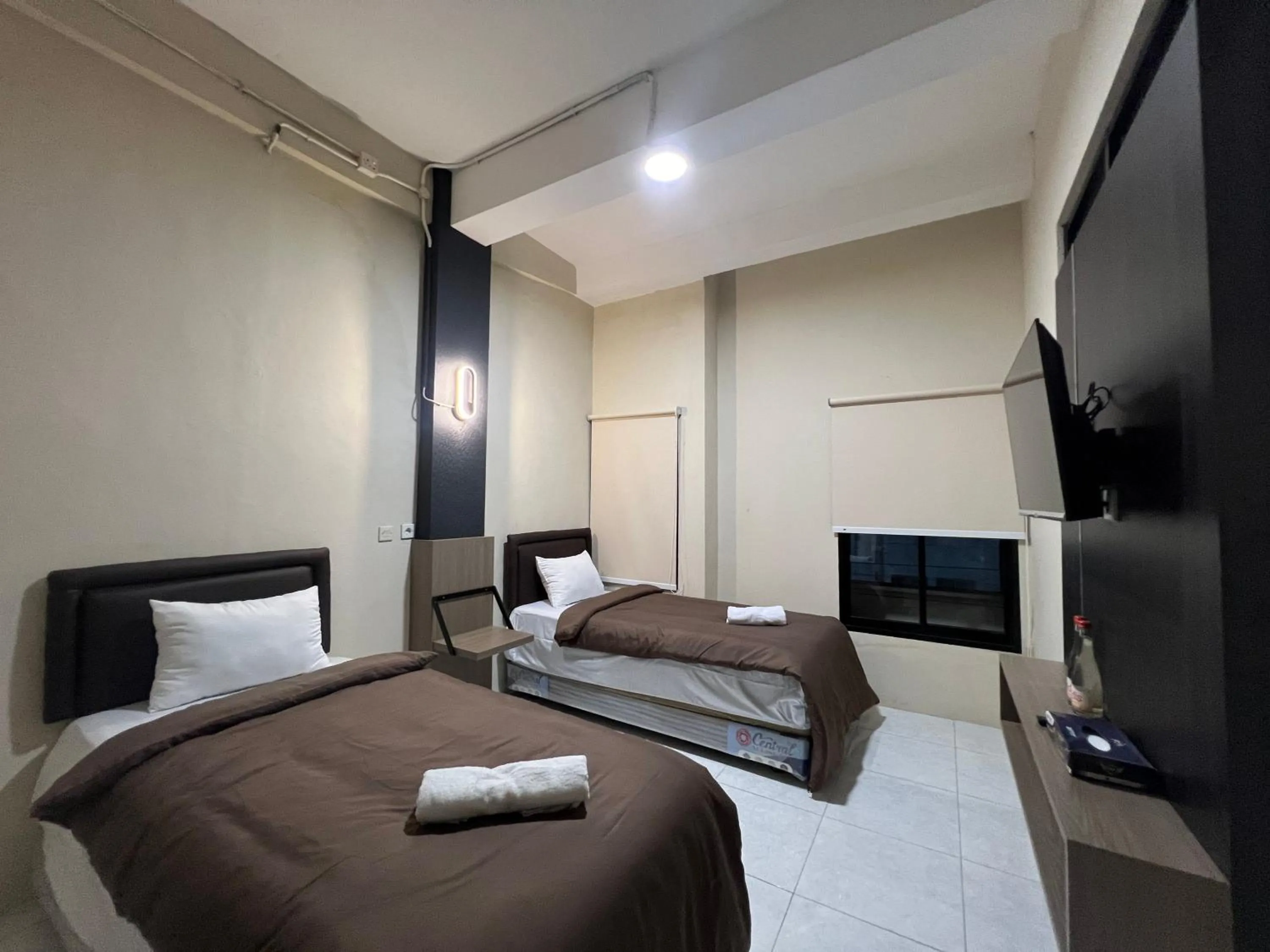 Bed in Brenn Hotel Semarang Mitra Reddoorz