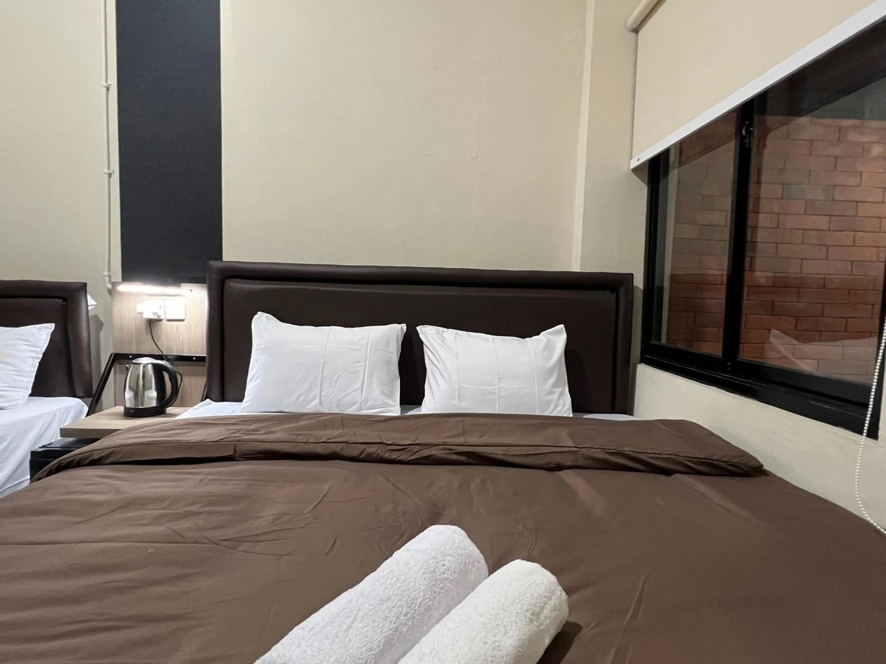 Bed in Brenn Hotel Semarang Mitra Reddoorz