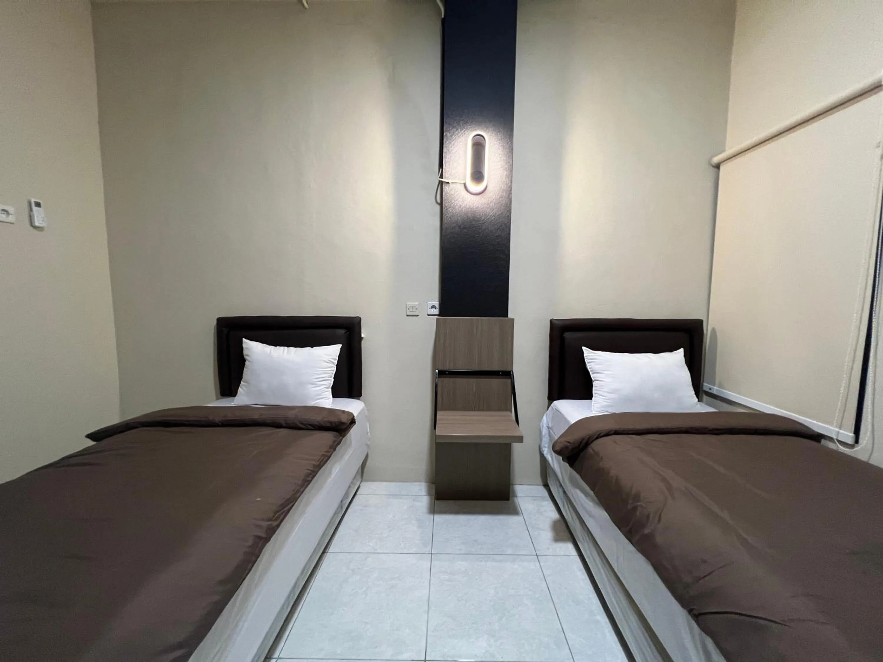 Bed in Brenn Hotel Semarang Mitra Reddoorz