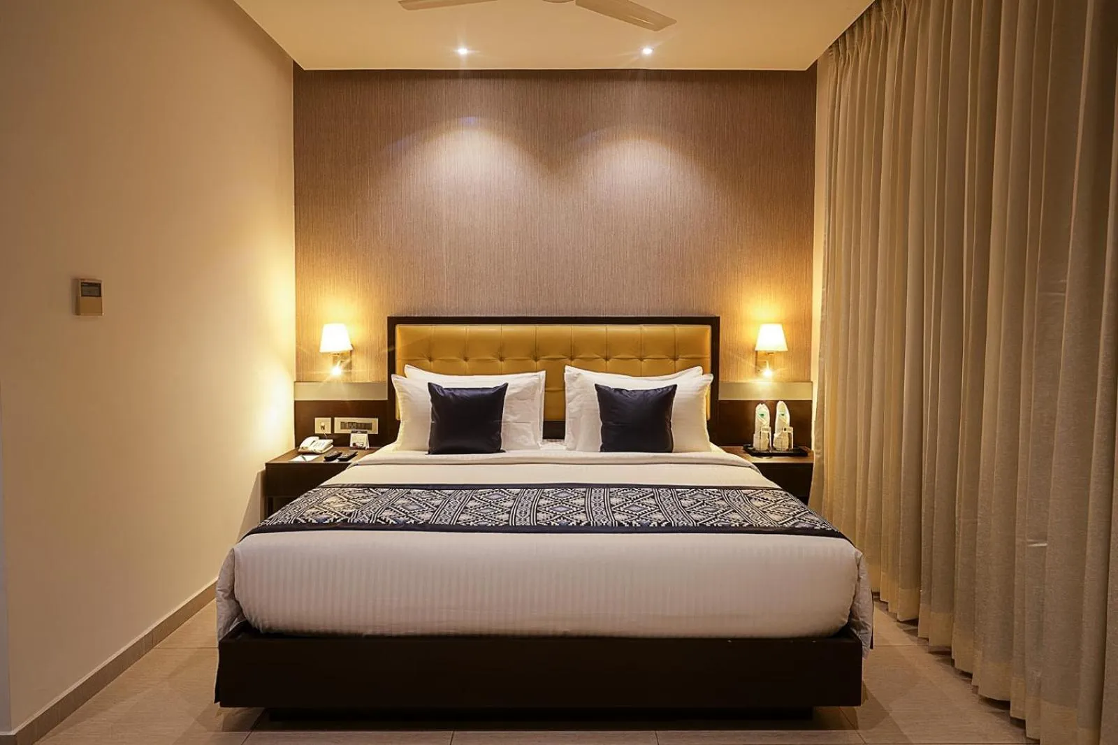 Bed in Grand Continent Malleshwaram A Sarovar Portico Affiliate Hotel