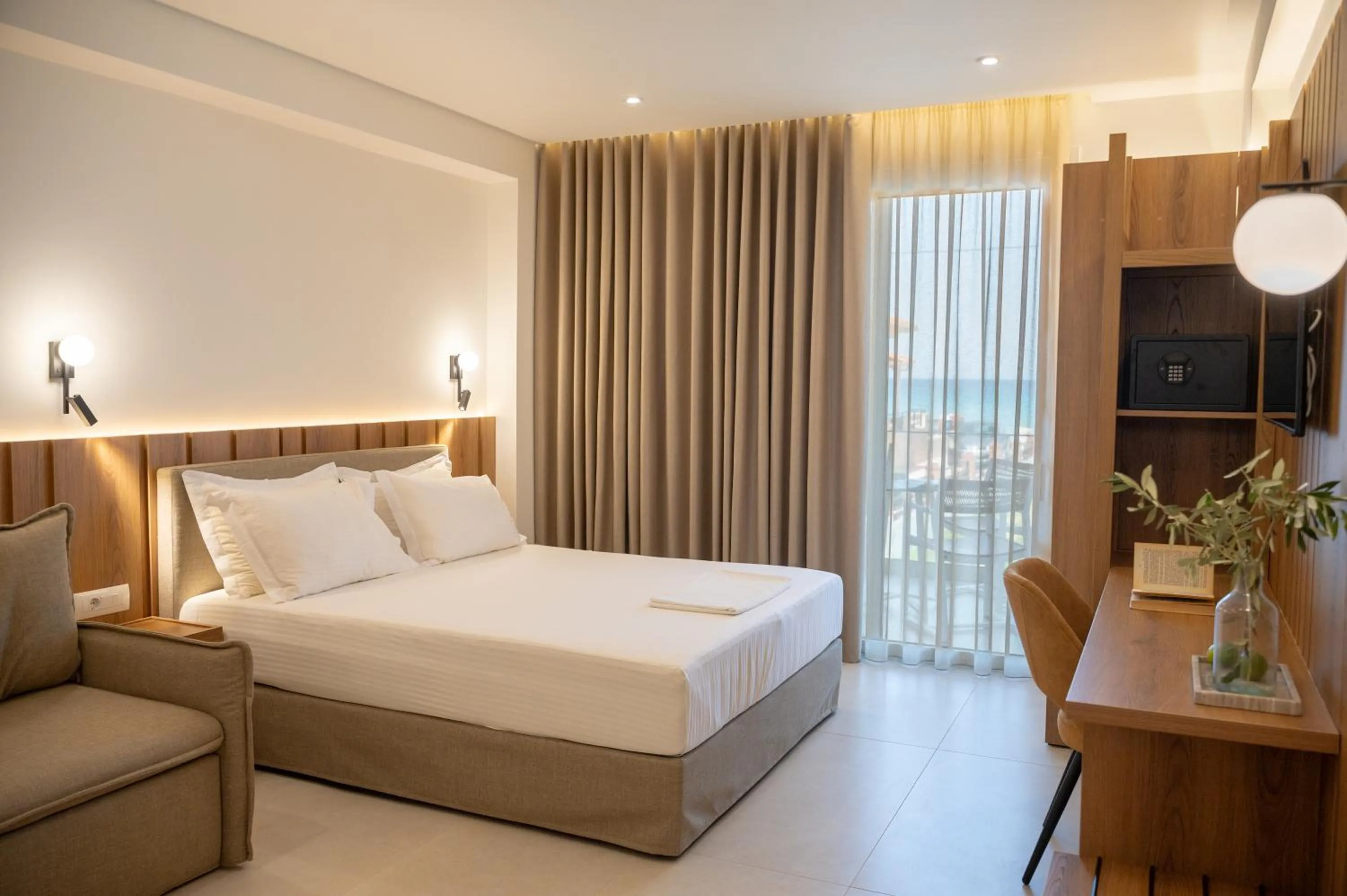 Bed in Sunrise SeaSide Suites