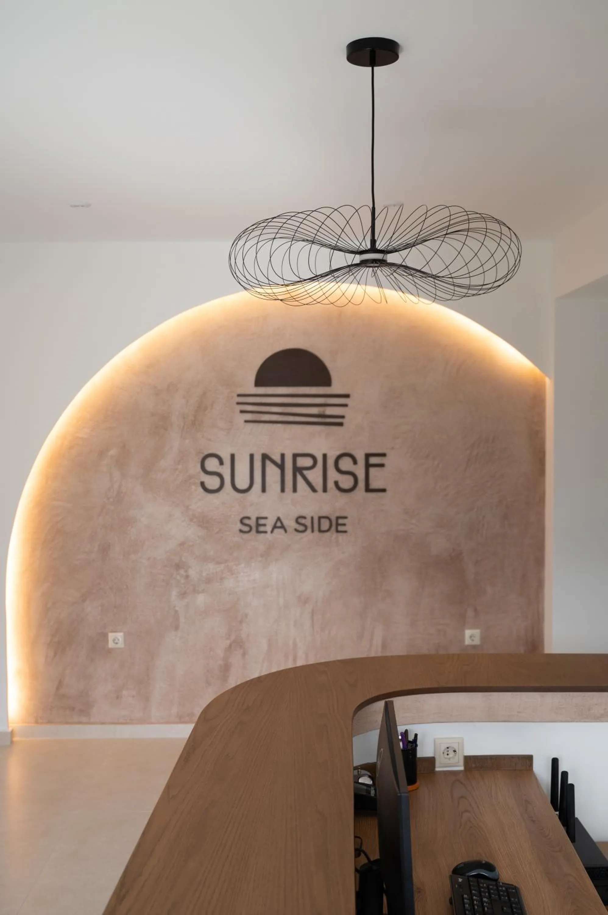 Property logo or sign in Sunrise SeaSide Suites