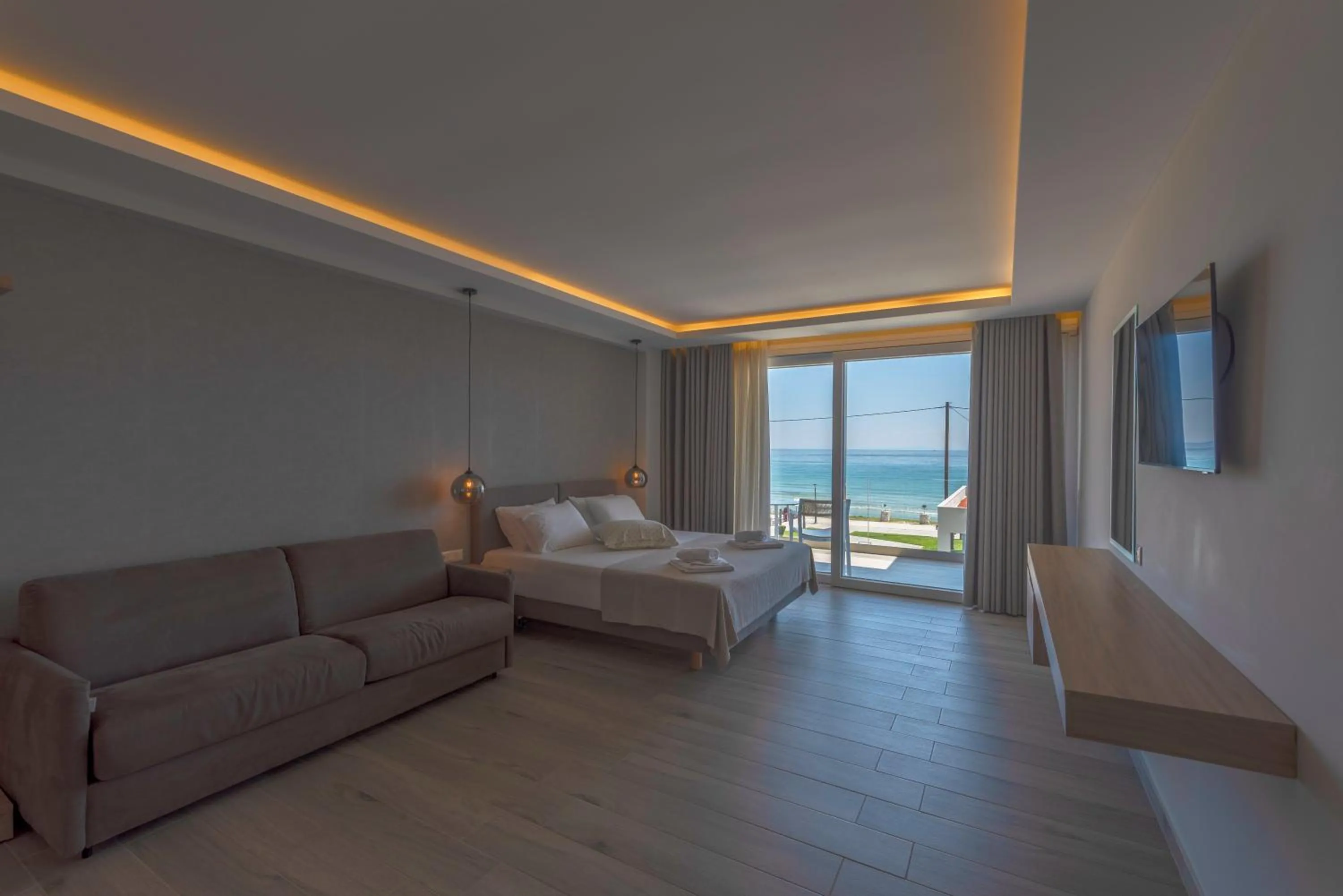 Bed in Sunrise SeaSide Suites